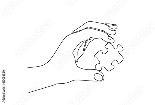 Continuous one line drawing of hand and puzzle. Business matching - connecting puzzle elements.  Puzzle game symbol and iconic business metaphor for problem solving, solution and strategy.