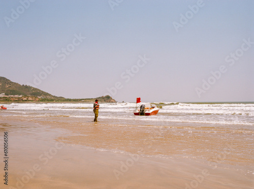people walking on the beach