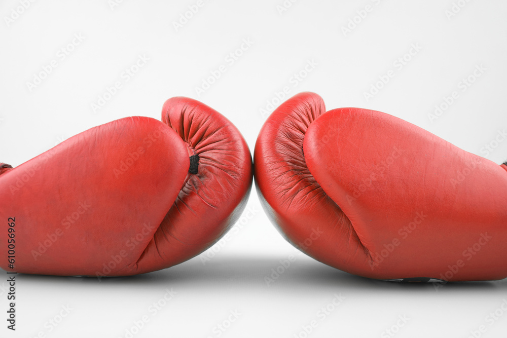 Fototapeta premium Red boxing gloves on a white background.