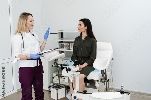 Consultation with gynecologist before colposcopy and pap test procedure to closely examine cervix, vagina and vulva of girl in gynecology clinic.