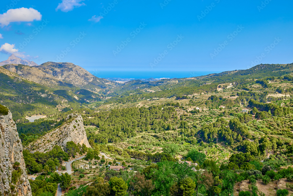 Scenic view of a mountains on a sunny day with blue sky