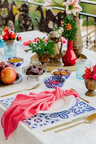 Outdoors, summer dinner at the balcony served for four persons served with inspiration from Morocco
