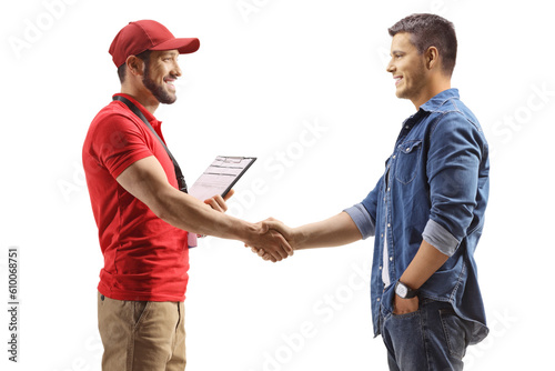 Profile shot of a delivery man shaking hands with a man