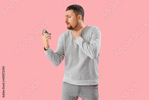 Sick man with inhaler on pi...