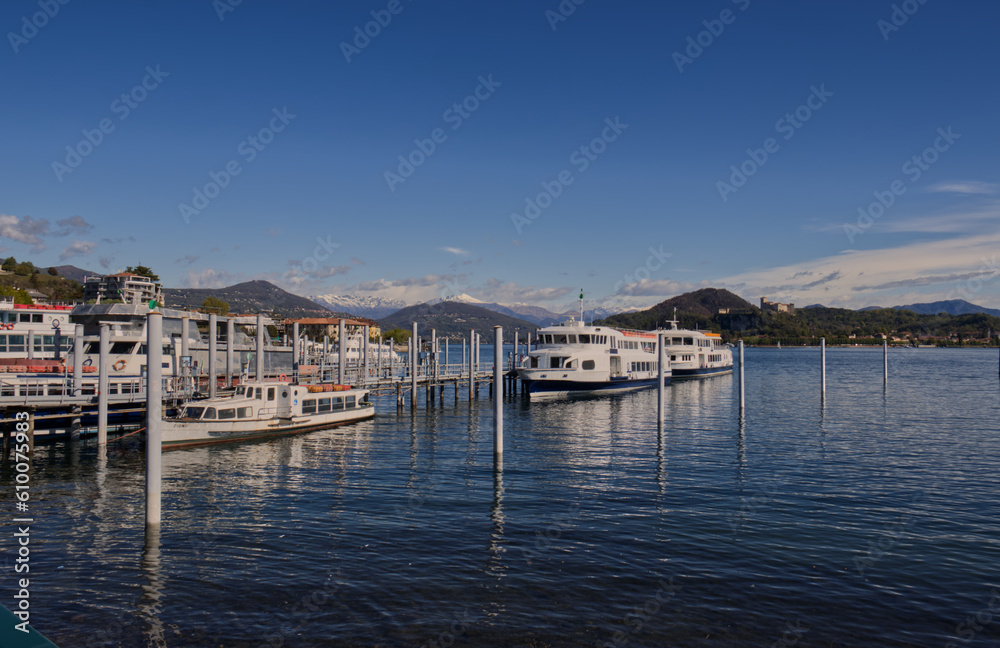 Boats for tourists docked at the port of Arona.