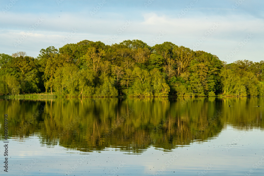 Panorama of the lake shore of the Mere with a perfect reflection in Ellesmere in Shropshire Panorama of the lake shore of the Mere with a perfect reflection in Ellesmere in Shropshire