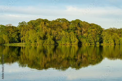 Panorama of the lake shore of the Mere with a perfect reflection in Ellesmere in Shropshire