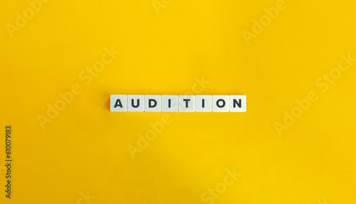 Photos Audition Word on Letter Tiles on Yellow Background