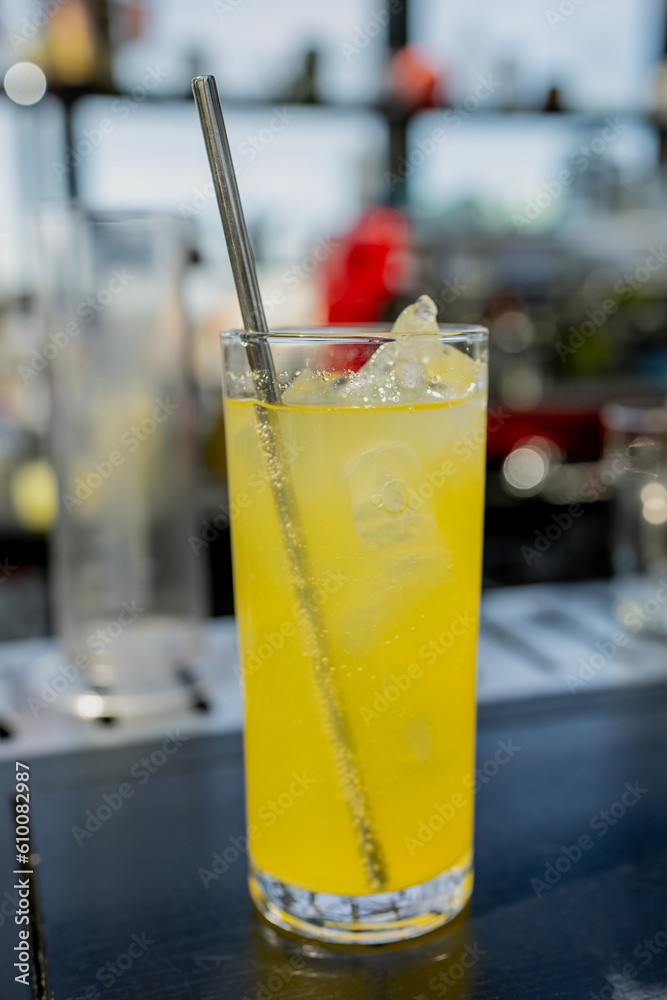 Yellow lemon ice cocktail in a bar on counter top Yellow lemon ice cocktail in a bar on counter top