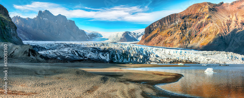 Breathtaking view of Skaftafellsjokull glacier tongue and volcanic mountains around on South Iceland.