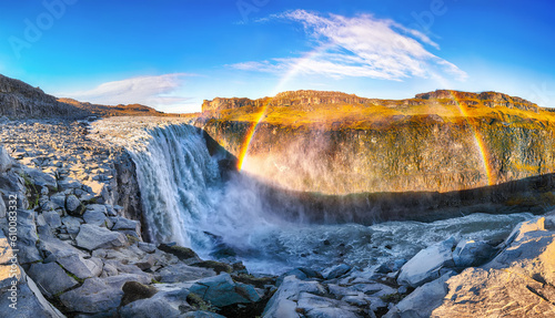 Breathtaking sunrise view of the most powerful waterfall in Europe called Dettifoss with rainbow © pilat666