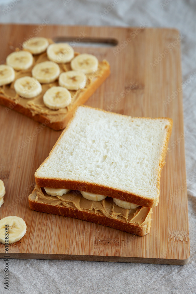 Homemade Peanut Butter Banana Sandwich on a Bamboo Board, side view.