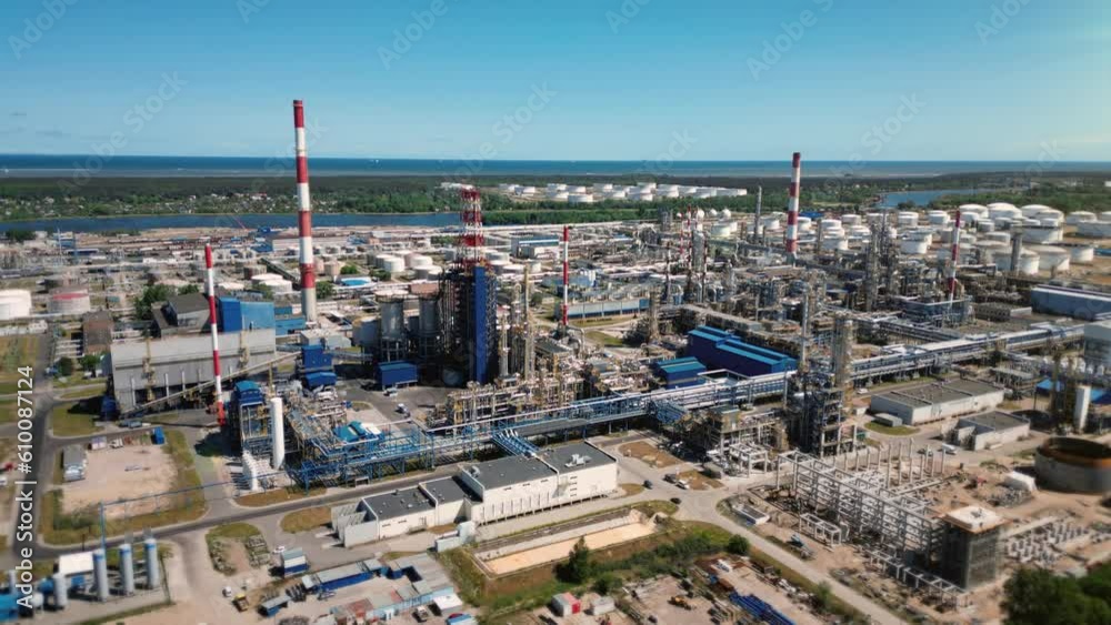 Aerial view of a large, modern oil refinery with oil storage tanks. Petroleum industry, gasoline and diesel production. Industrial plant with many tanks for storage of oil and pipelines. 4k footage Aerial view of a large, modern oil refinery with oil storage tanks. Petroleum industry, gasoline and diesel production. Industrial plant with many tanks for storage of oil and pipelines. 4k footage