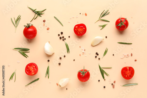 Fototapeta Naklejka Na Ścianę i Meble -  Composition with ripe cherry tomatoes and spices on beige background
