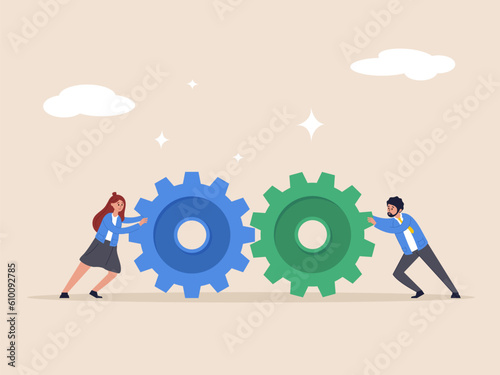 Teamwork and cooperation concept. Business setting, idea that working together can lead to success, collaboration or synergy, businessman push gear cogwheels together leading to success.