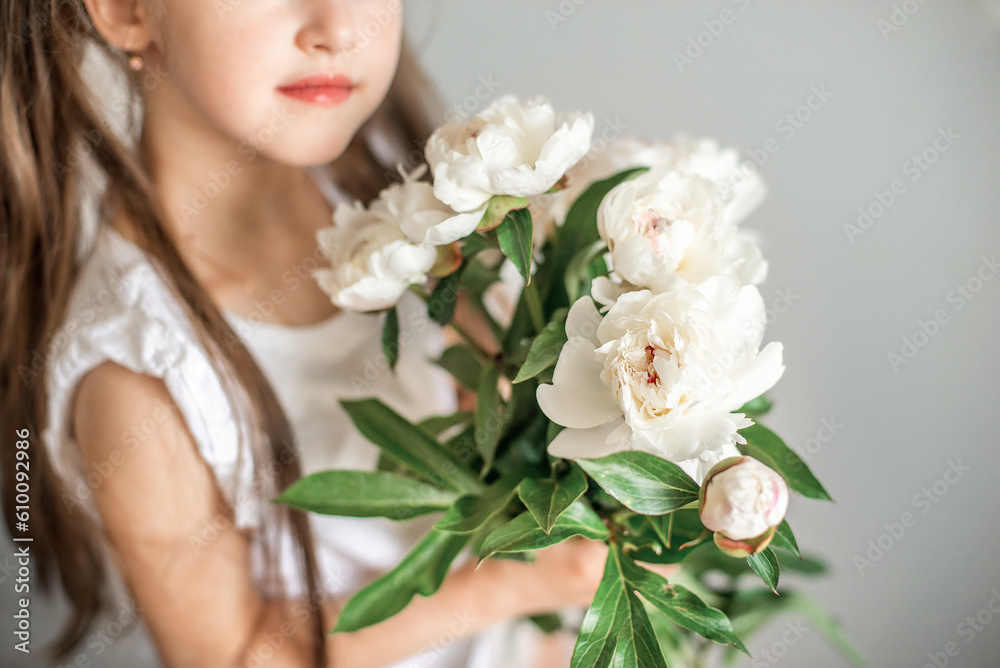  girl with a bouquet of white flowers peonies 