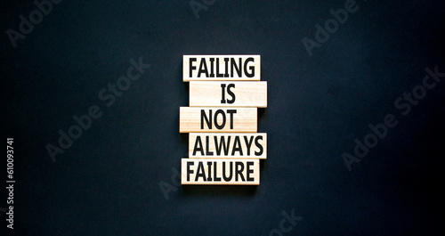 Failure or failing symbol. Concept words Failing is not always failure on wooden block. Beautiful black table black background. Business, failure or failing concept. Copy space.