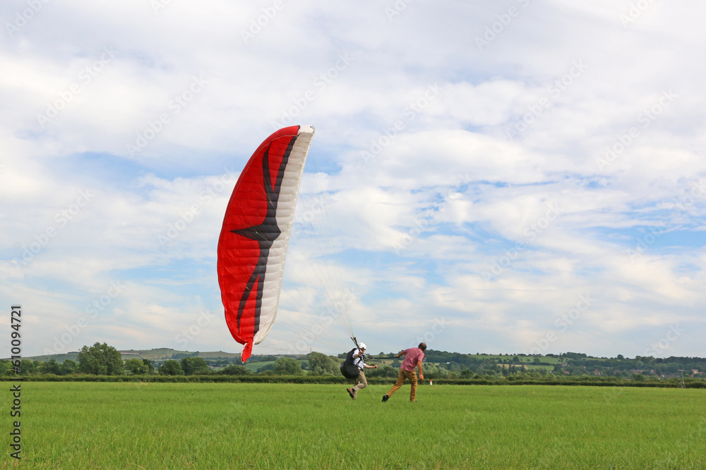 Obraz premium Paraglider launching wing in a field 