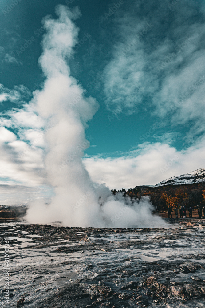Strokkur geyser in southwestern Iceland. Erupting fountain-type geyser in Haukadalur valley on the slopes of Laugarfjall hill, which is also the home to Geysir geyser.