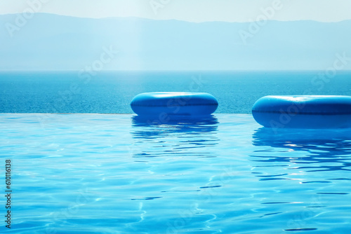 Infinity swimming pool with sea and Mountain View