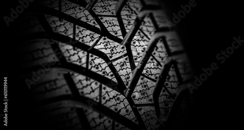 Fotografie Winter tire tread. Car tire tread close up. Studio shot.