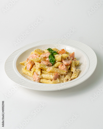 Salmon pasta on white background