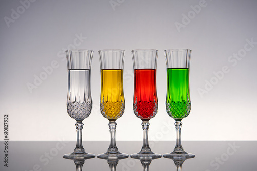 Champagne glass on shiny gray surface