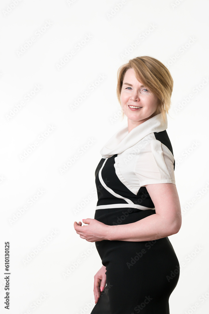 Smiling confident stylish mature adult businesswoman looking at camera standing on white background Smiling confident stylish mature adult businesswoman looking at camera standing on white background