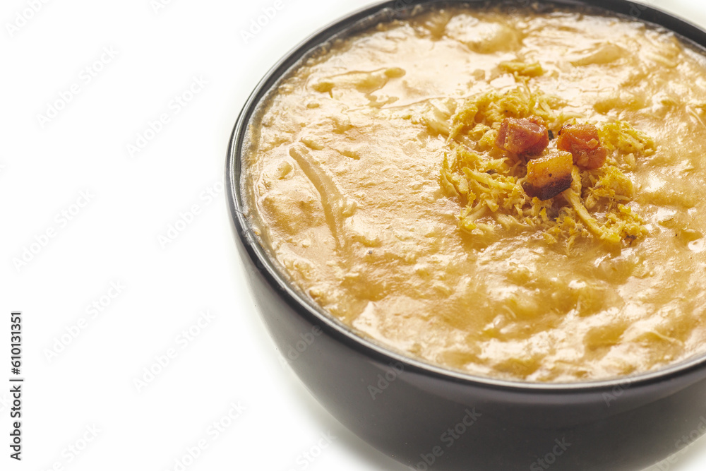 cassava broth with chicken known as CALDO DE KENGA or QUENGA , Typical Brazilian food, typically from Brazilian cuisine, on white background with selective focus cassava broth with chicken known as CALDO DE KENGA or QUENGA , Typical Brazilian food, typically from Brazilian cuisine, on white background with selective focus