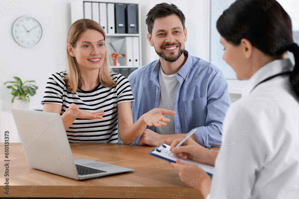 Couple having appointment with fertility doctor in clinic. Patient consultation Couple having appointment with fertility doctor in clinic. Patient consultation