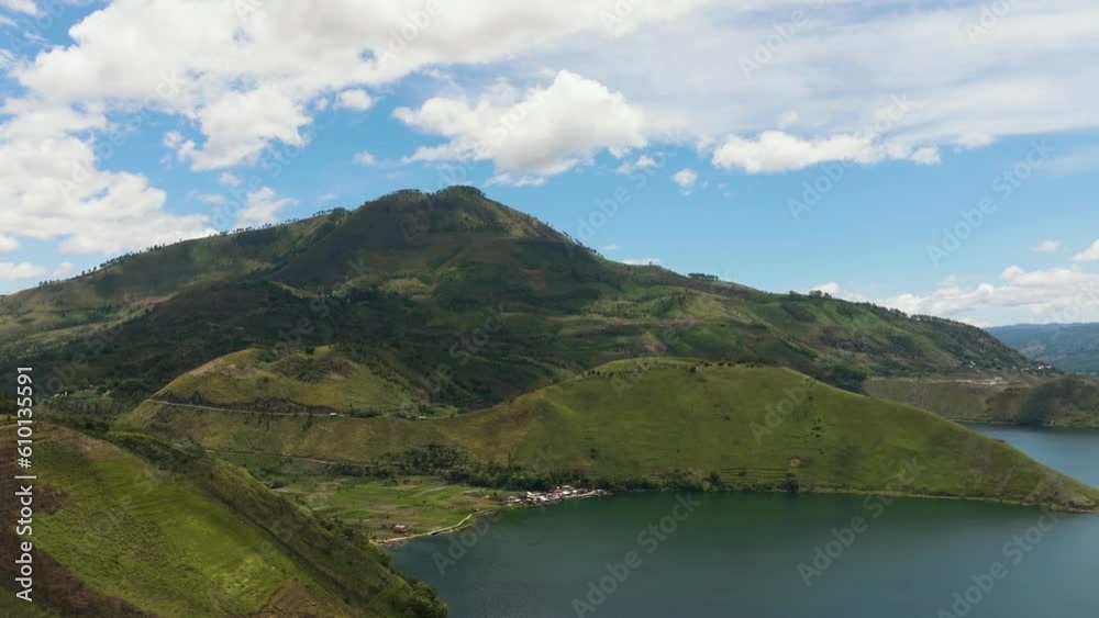 Top view of lake Toba is located in the crater of a volcano and mountains. Sumatra, Indonesia. Top view of lake Toba is located in the crater of a volcano and mountains. Sumatra, Indonesia.
