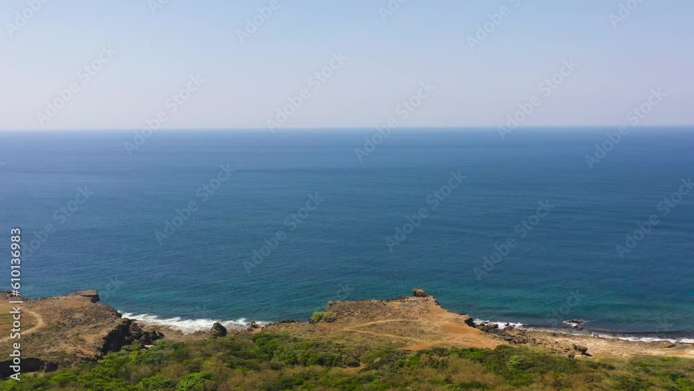 Rocky coastline and blue ocean. Philippines. Rocky coastline and blue ocean. Philippines.