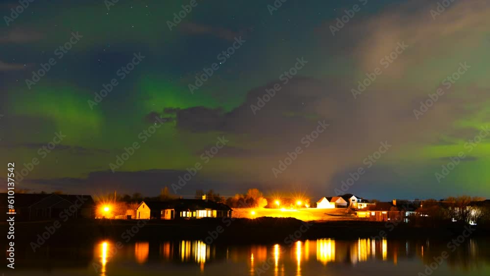 Northern lights, aurora borealis, time lapse with moving clouds. The movement of auroras, clouds and stars, with reflections in tranquil waters, creates an exceptional night sky scenic.
Northern lights, aurora borealis, time lapse with moving clouds. The movement of auroras, clouds and stars, with reflections in tranquil waters, creates an exceptional night sky scenic.