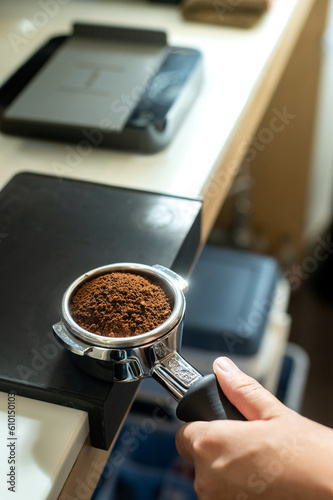 Coffee machine with ground coffee in a cafe, close up