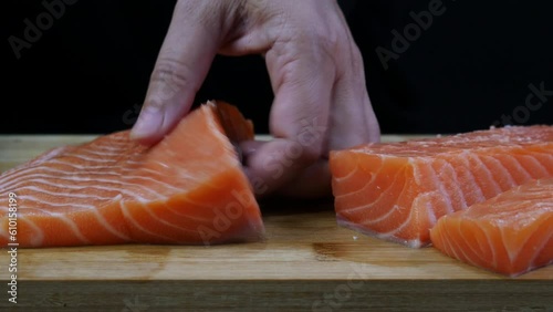 chef is cutting fresh salmon trout fillet prepare for making food, sushi sashimi cooking delicious famous asian japanese korean sea food