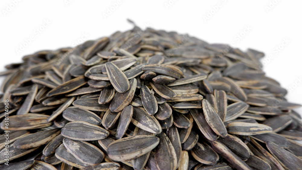 A lot of sunflower seeds on a white background
