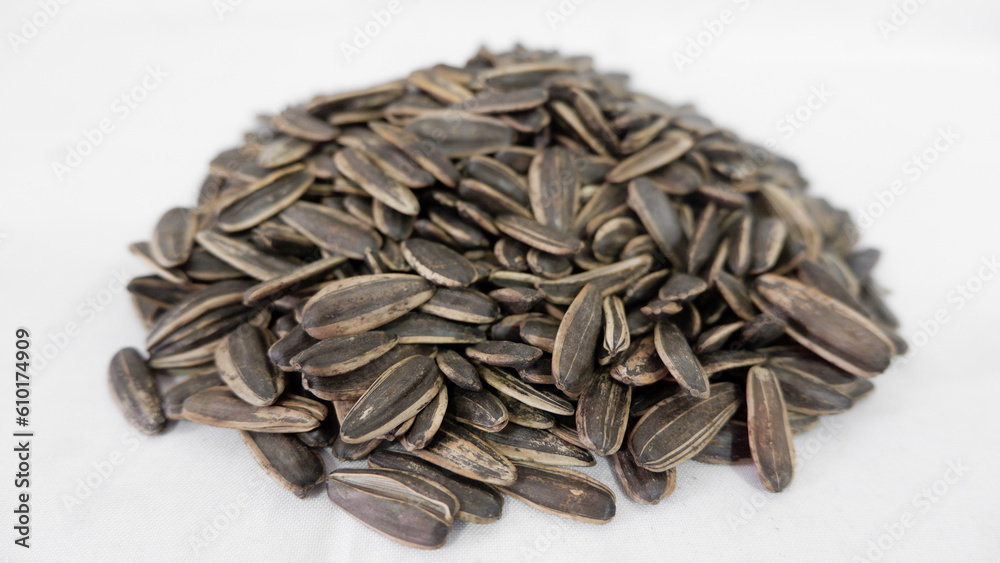 A lot of sunflower seeds on a white background
