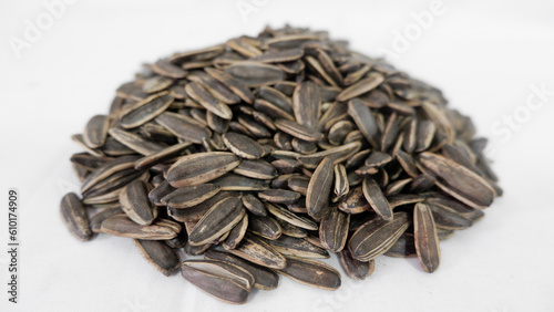 A lot of sunflower seeds on a white background
