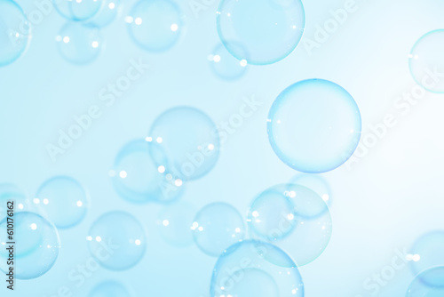 Beautiful Transparent A Blue Soap Bubbles. Abstract Background. Celebration Festive Backdrop. Freshness Soap Suds Bubbles Water 