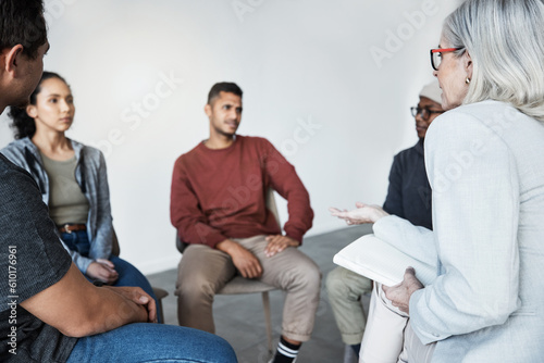 Fototapeta Naklejka Na Ścianę i Meble -  Counselling, psychologist and group of patients at a therapy session for mental health or depression. Community, diversity and people or friends in a circle talking to therapist at psychology center.