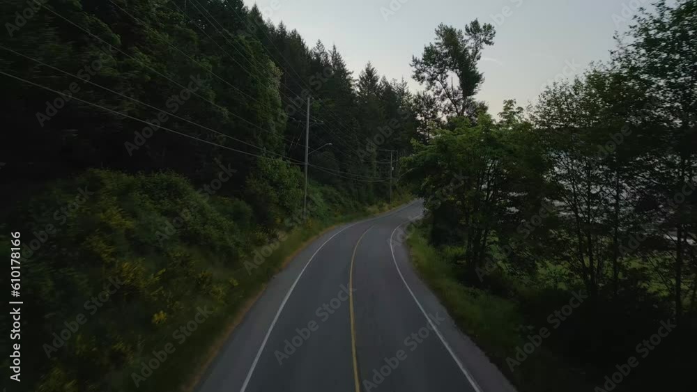 Scenic Road by Farms covered in fog. Sunny Sunrise Twilight. Vancouver Island, British Columbia, Canada. Aerial Cinematic Scenic Road by Farms covered in fog. Sunny Sunrise Twilight. Vancouver Island, British Columbia, Canada. Aerial Cinematic