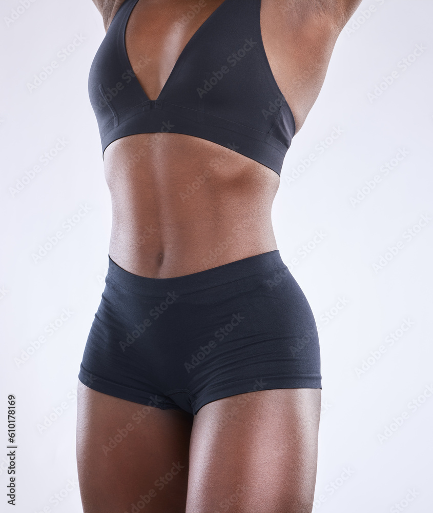 Stomach, fitness and health with black woman in studio for nutrition, weight loss and diet. Beauty, wellness and body muscle with closeup of female model on white background for self care and glow