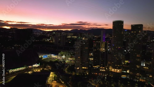 Wallpaper Mural Drone flying in front of illuminated condos and the Parque La Mexicana, dusk in Santa Fe, Mexico city Torontodigital.ca