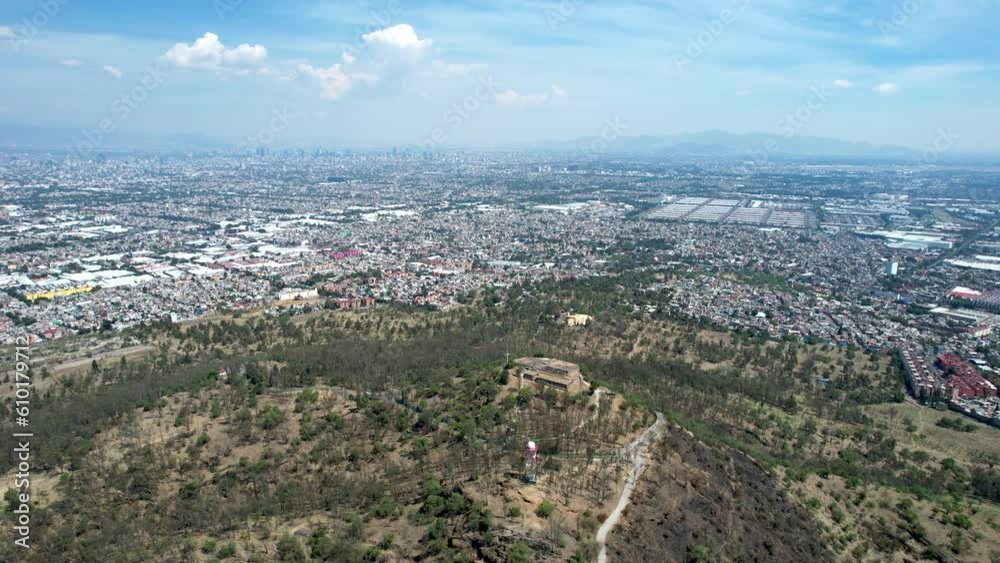 frontal drone shot of east Mexico city over cerro de la estrella in iztapalapa frontal drone shot of east Mexico city over cerro de la estrella in iztapalapa