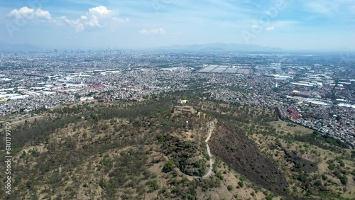 orbital drone shot of east Mexico city over cerro de la estrella in iztapalapa photo