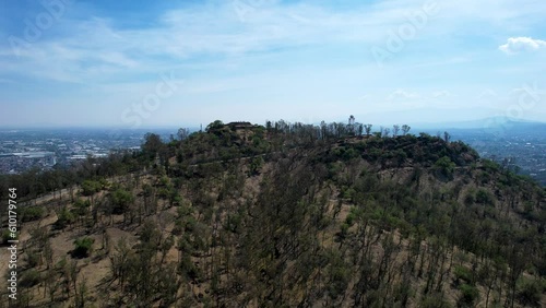 take off drone shot of east Mexico city over cerro de la estrella in iztapalapa in the morning photo