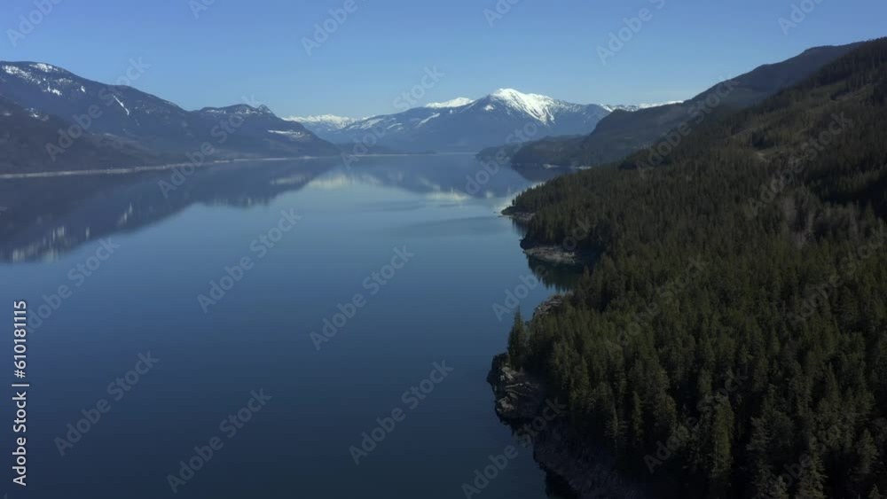 Radiant Haven: Arrow Lake Basks in Sunshine, Cradled by Majestic Mountains and Verdant Forests Radiant Haven: Arrow Lake Basks in Sunshine, Cradled by Majestic Mountains and Verdant Forests