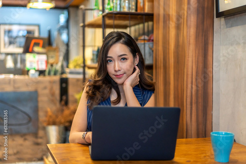Portrait of creative woman use laptop work digital online marketing internet advertising and sales business technology concept, online marketing, E-business, Ecommerce, Business online at cafe