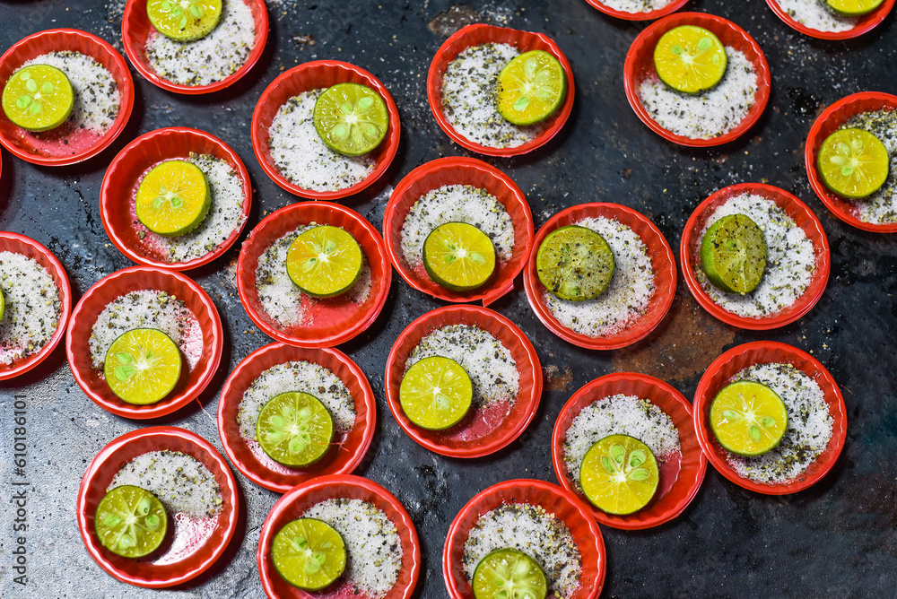 Many prepared plates with vietnamese spices with salt, pepper, lime Many prepared plates with vietnamese spices with salt, pepper, lime