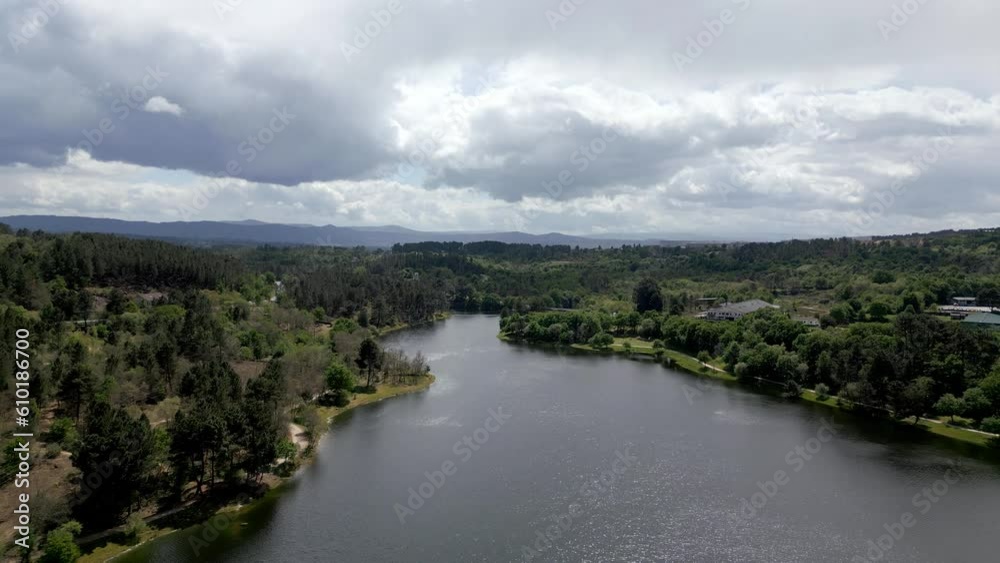Corner edge of reservoir in Cachamuina Ourense Spain with low hanging grey cloud Corner edge of reservoir in Cachamuina Ourense Spain with low hanging grey cloud